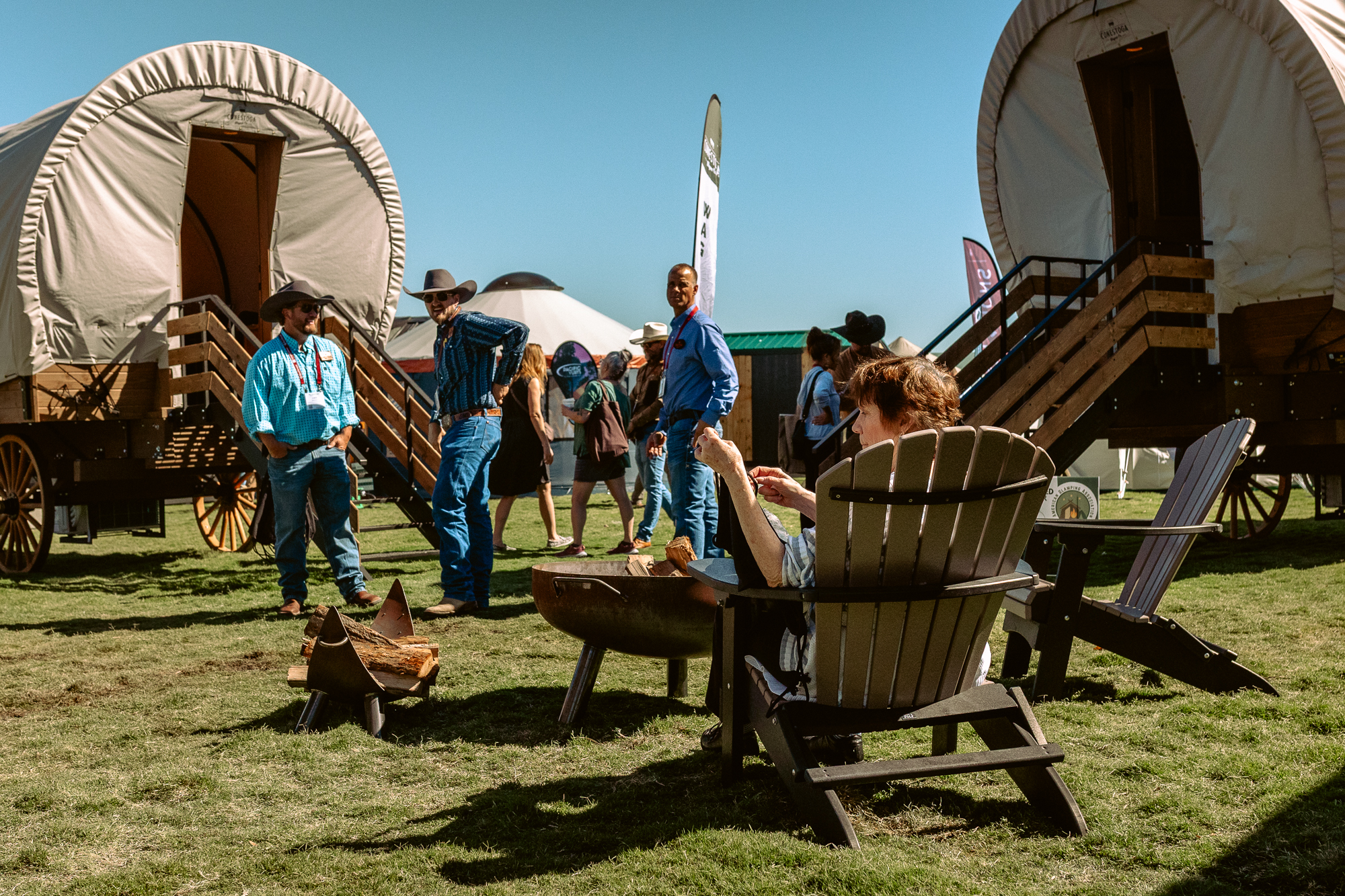 Glamping Show Americas attendees check out the Conestoga wagons.